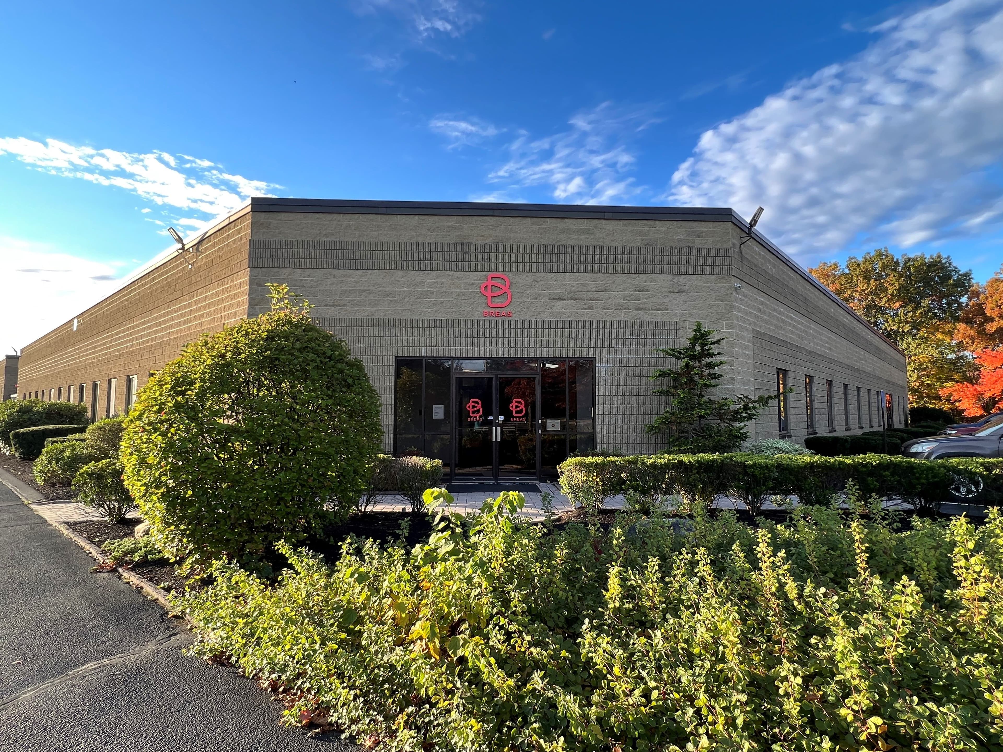 An office building with a Breas Logo close to the entrance.